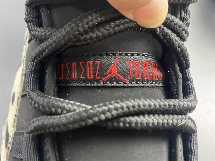 air jordan 11 “animal instinct” black / red / sail / white ar0715-010