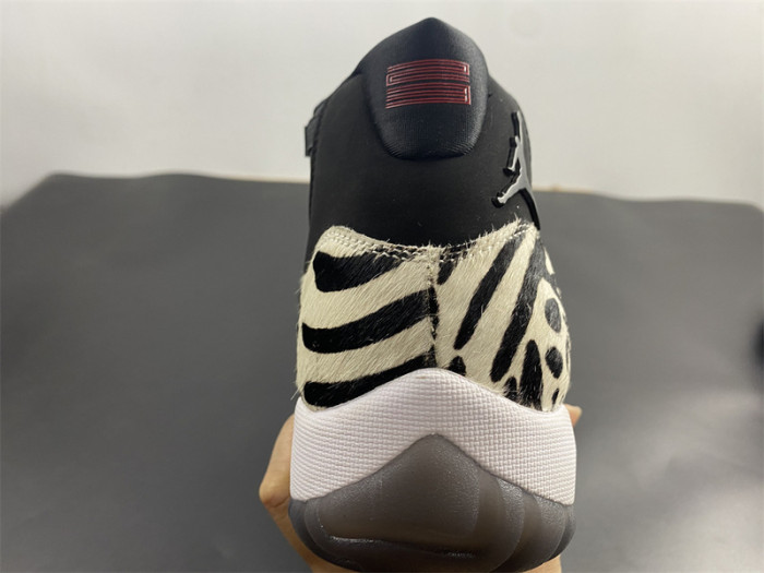 air jordan 11 “animal instinct” black / red / sail / white ar0715-010