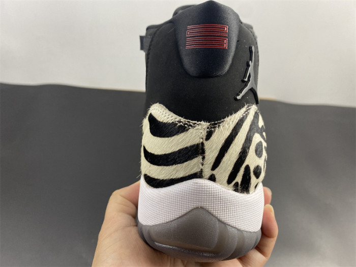 air jordan 11 “animal instinct” black / red / sail / white ar0715-010